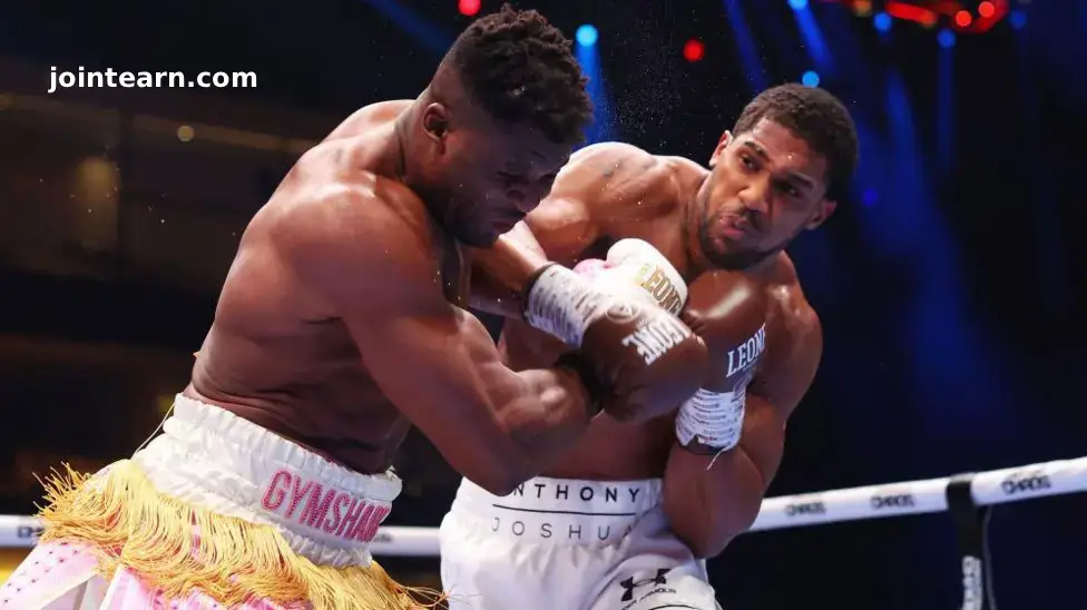 Anthony Joshua Will Knock Jake Paul Out Quickly, Insists Eddie Hearn: “This Fight Is Not Scripted”