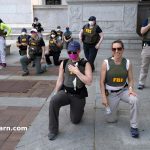 FBI Reassigns Agents Photographed Kneeling During 2020 Racial Justice Protest, Sources Say